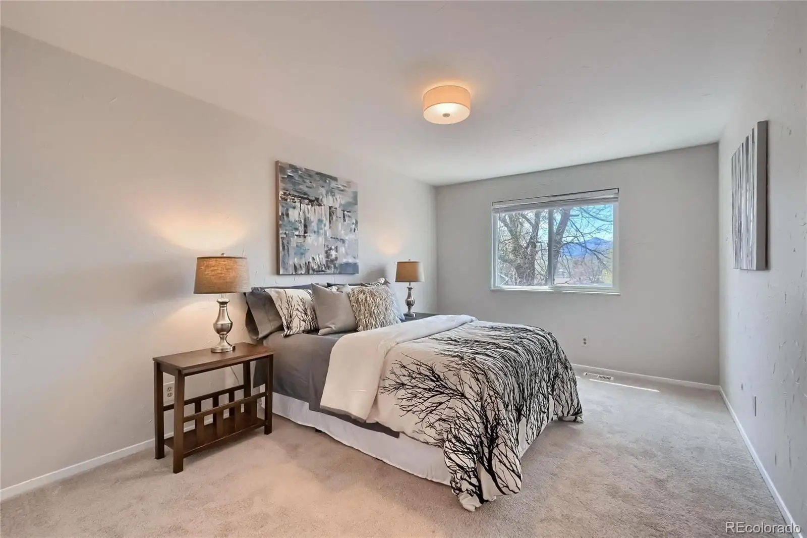 A bedroom with a bed and a night stand at 5803 South Miller Street