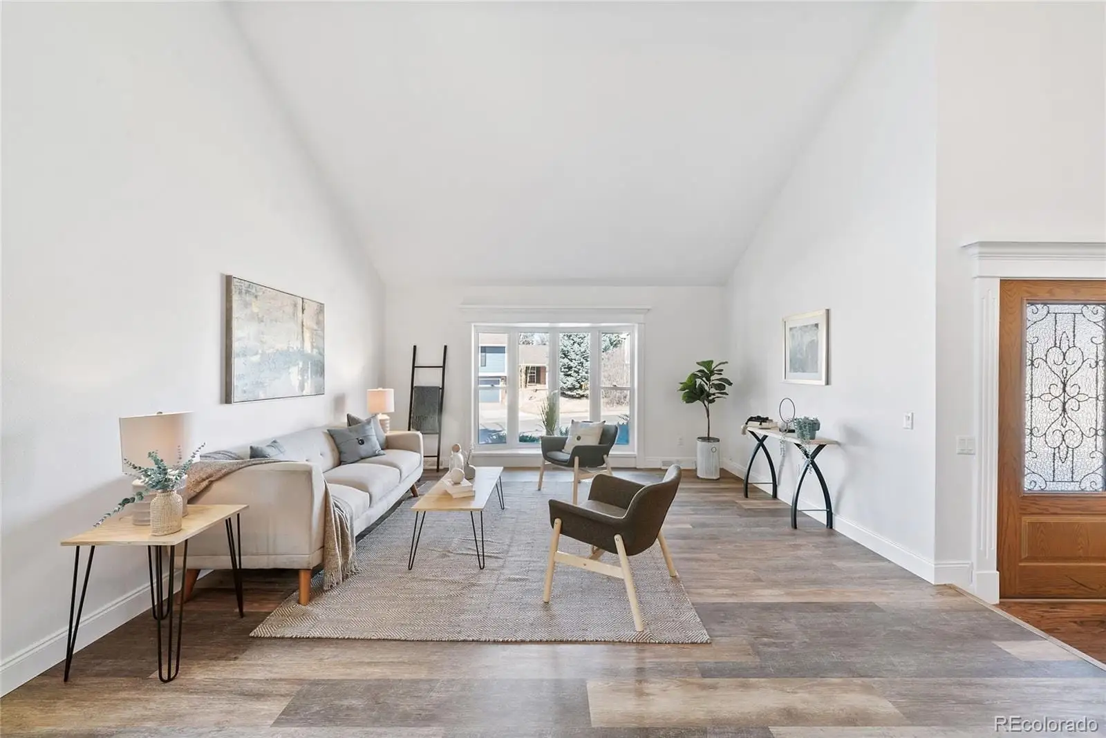 A living room with furniture and a window at 8876 East Phillips Place
