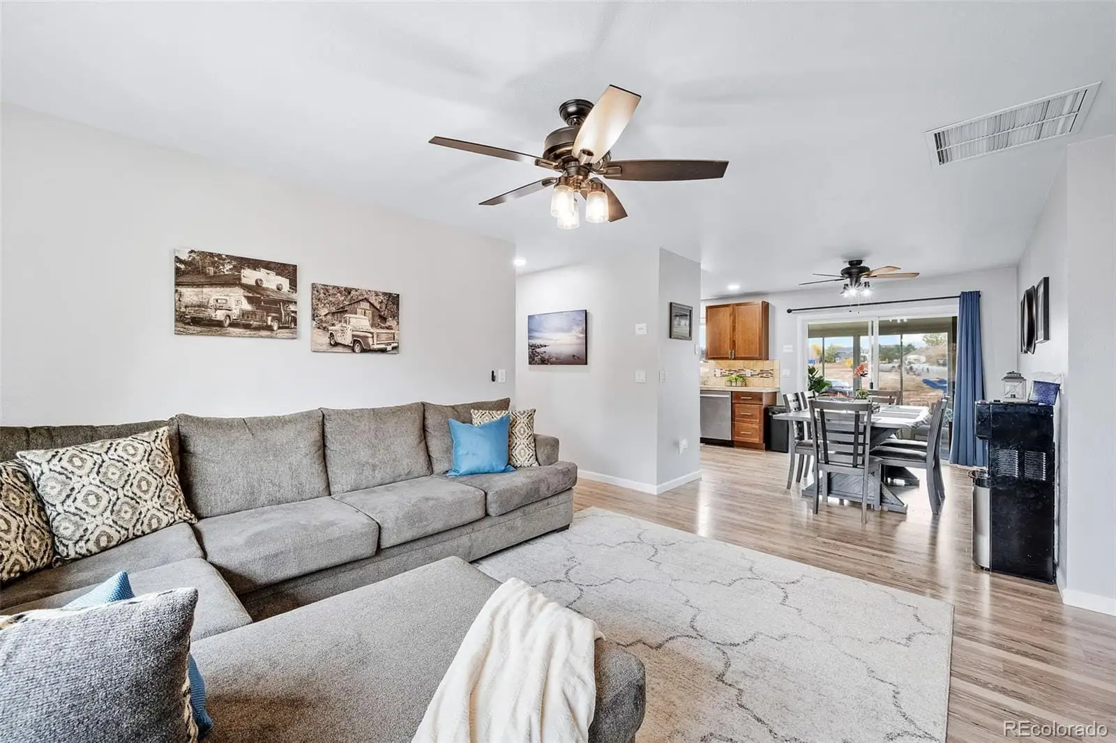 A living room with furniture and kitchen view at 300 South 33rd Avenue