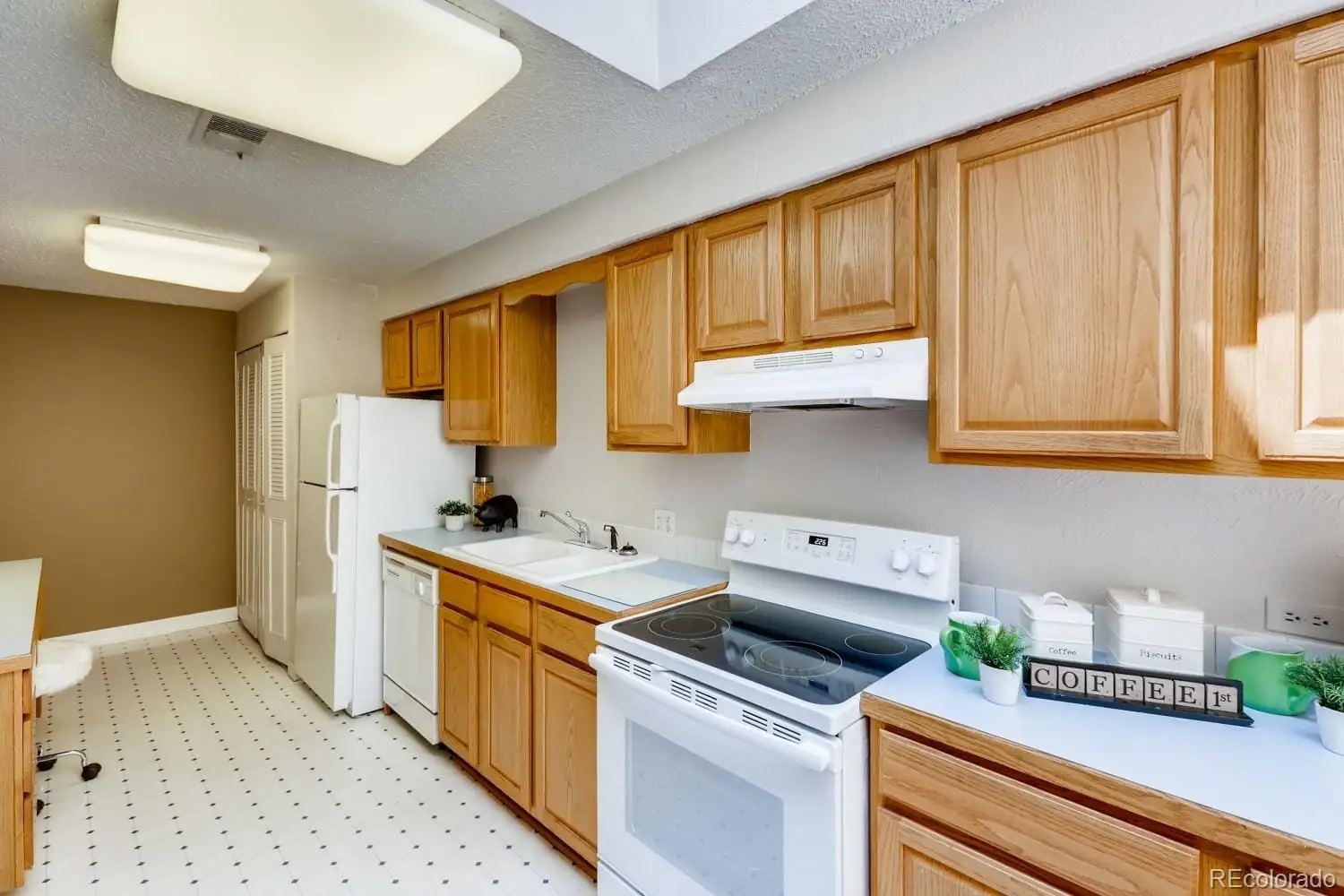 A kitchen with a sink cabinets and appliances at 2847 South Locust Street