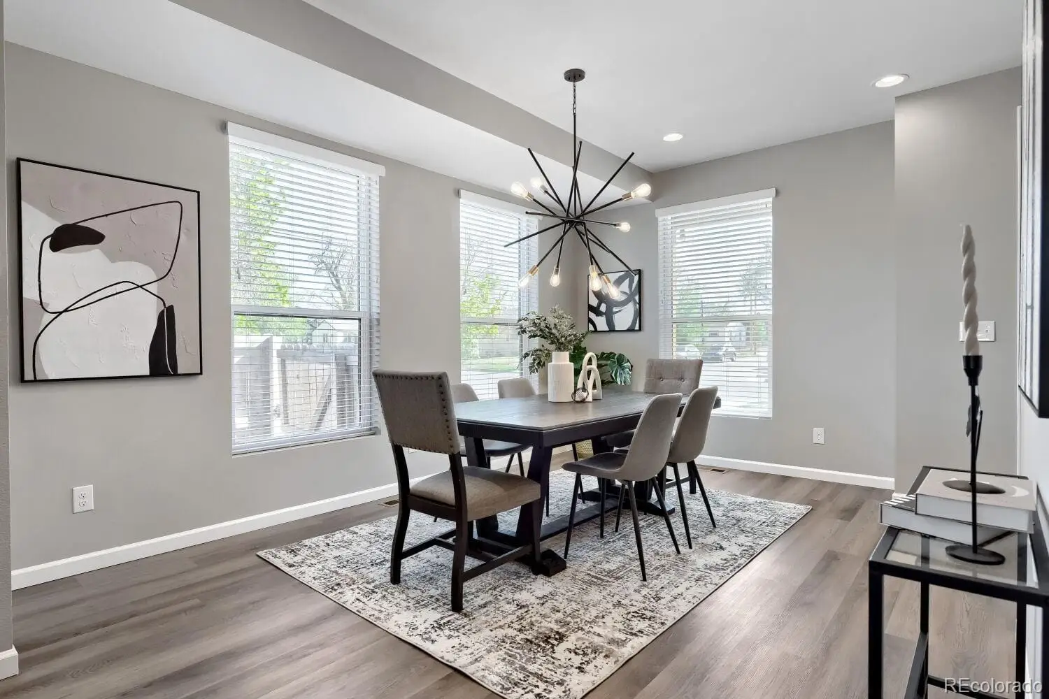 A view of a dining room with furniture window and wooden floor at 3007 South Cherokee Street