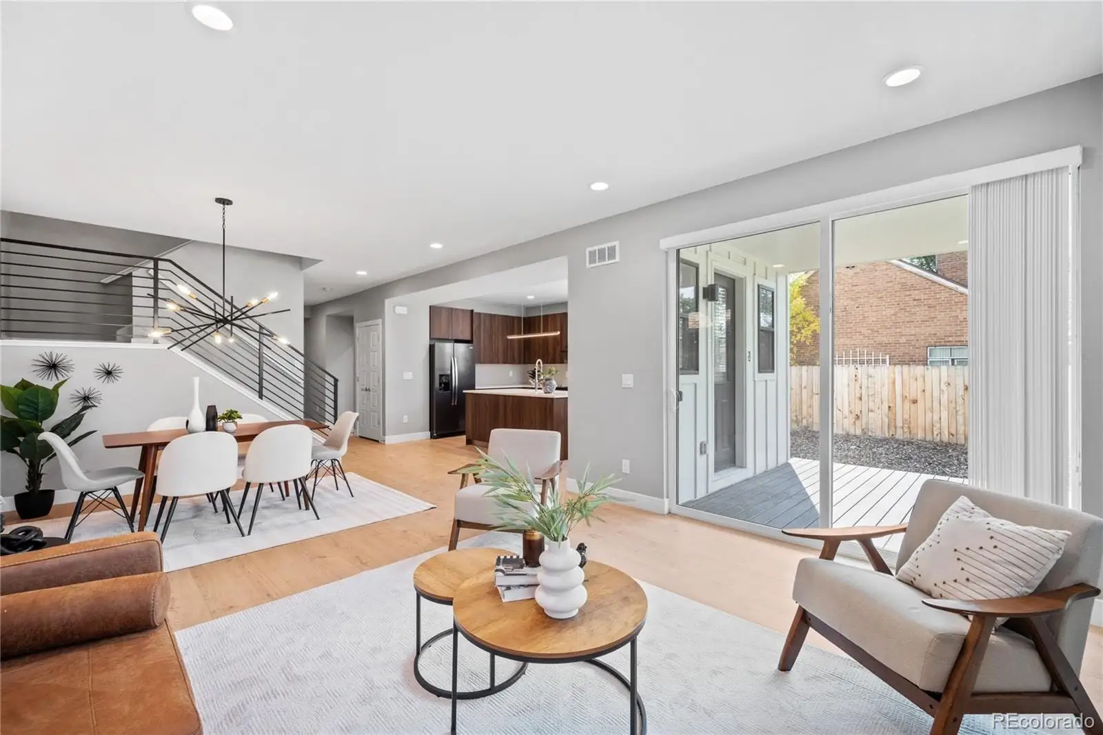 A living room with furniture and a large window at 2865 Holly Street