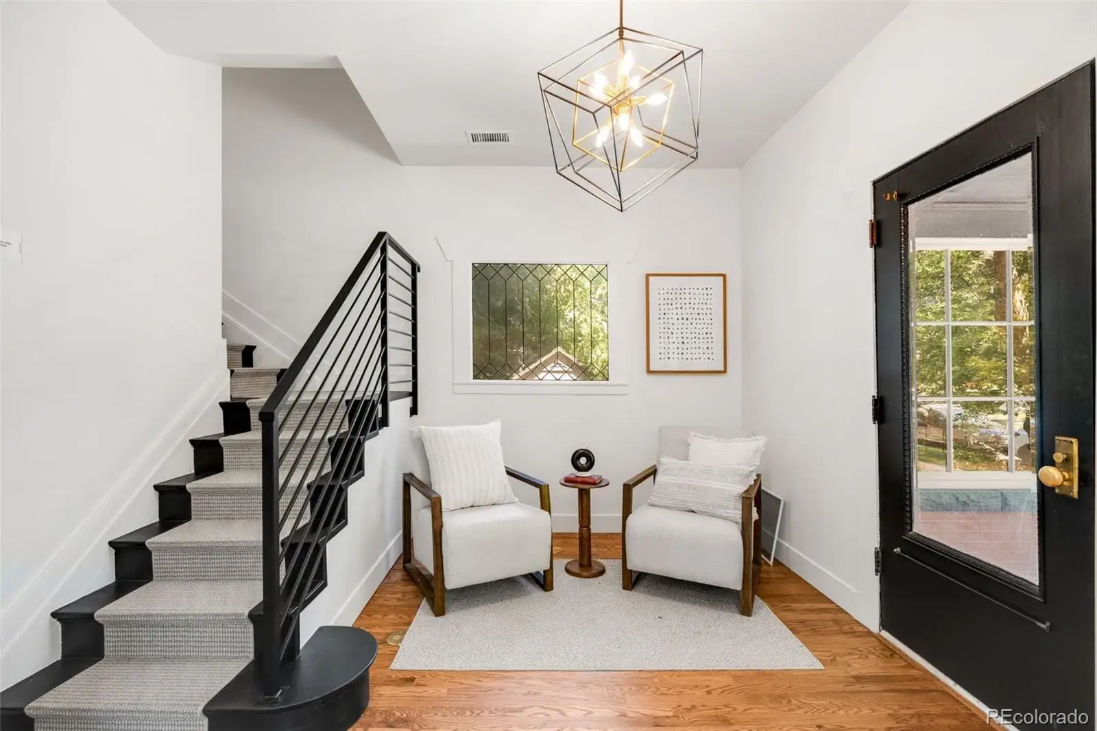 A living room with furniture or chandelier and a rug at 2343 Dahlia Street