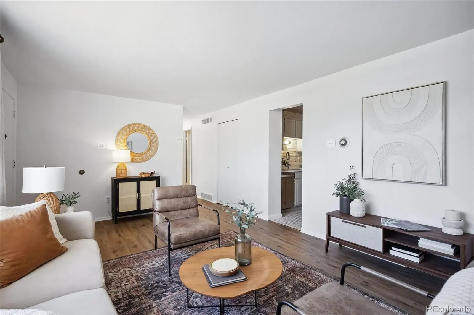 A living room with furniture and a potted plant at 3417 South Chester Court