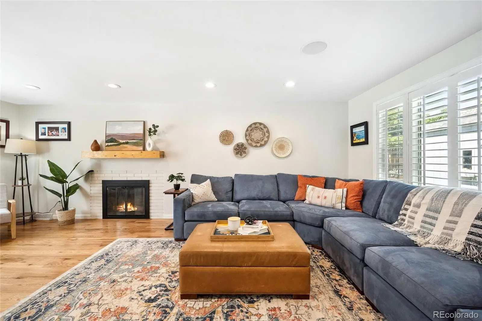 A living room with furniture and a fireplace at 1907 South Leyden Street