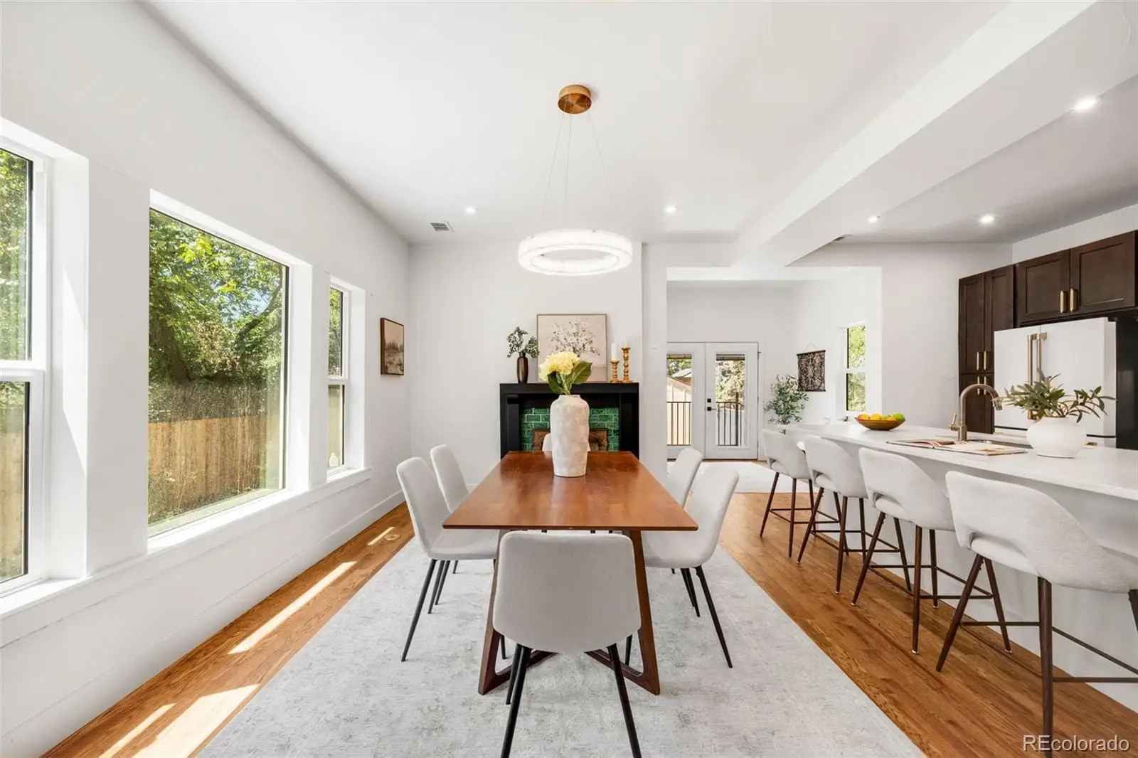 A view of a dining room with furniture window and outside view at 2343 Dahlia Street