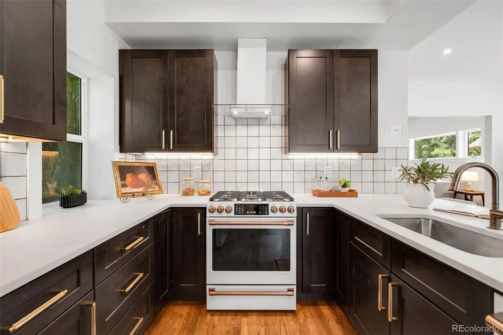 A kitchen with a sink stove and cabinets at 2343 Dahlia Street