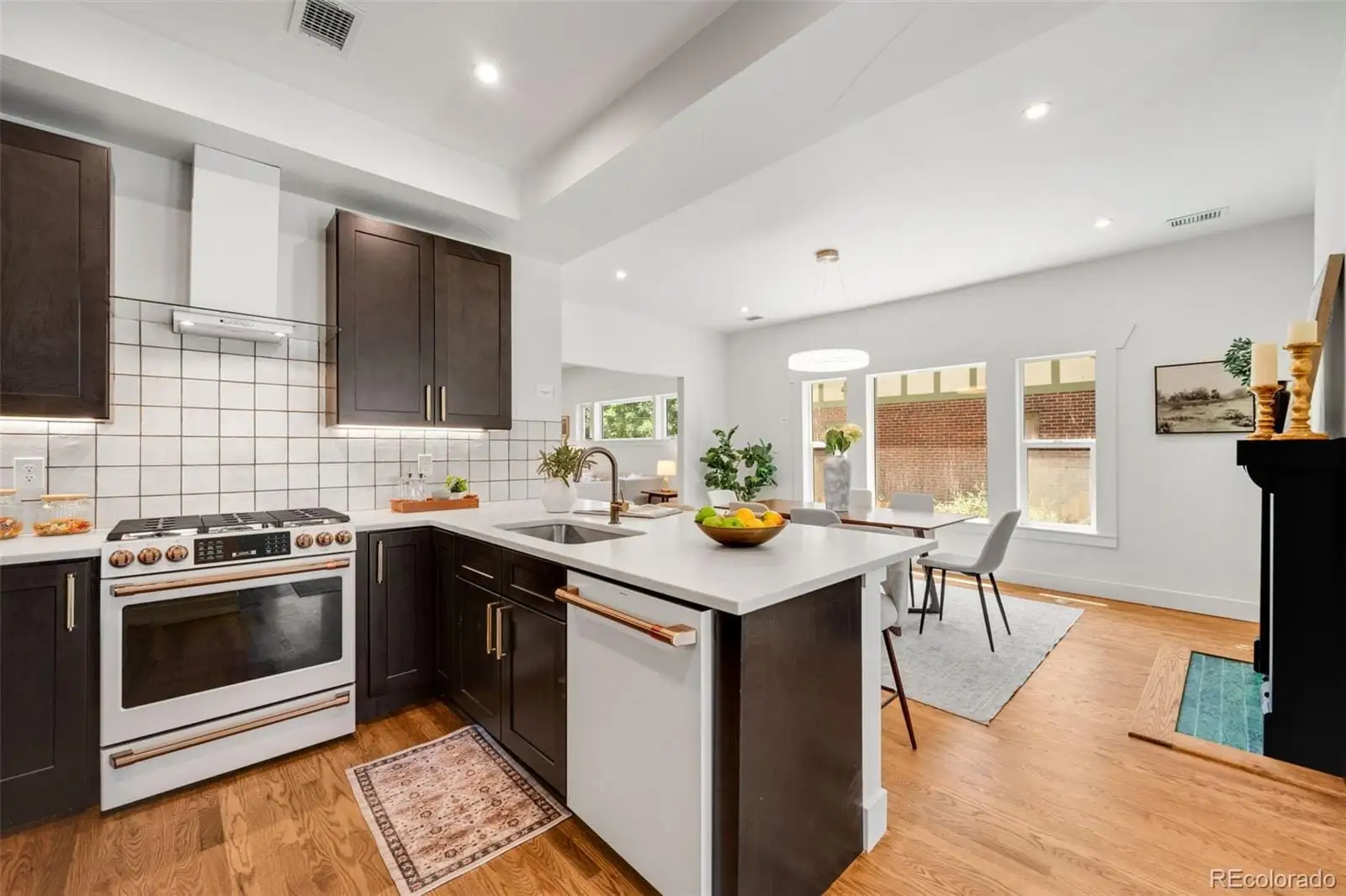 A kitchen with a stove sink and microwave at 2343 Dahlia Street