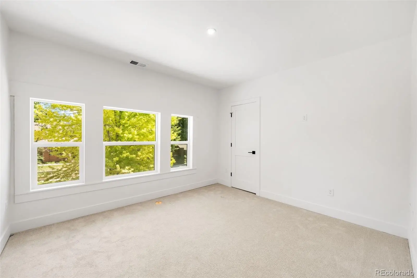 An empty room with a window at 2343 Dahlia Street