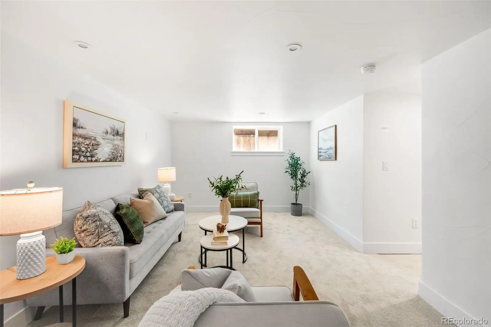 A living room with furniture and wooden floor at 2343 Dahlia Street