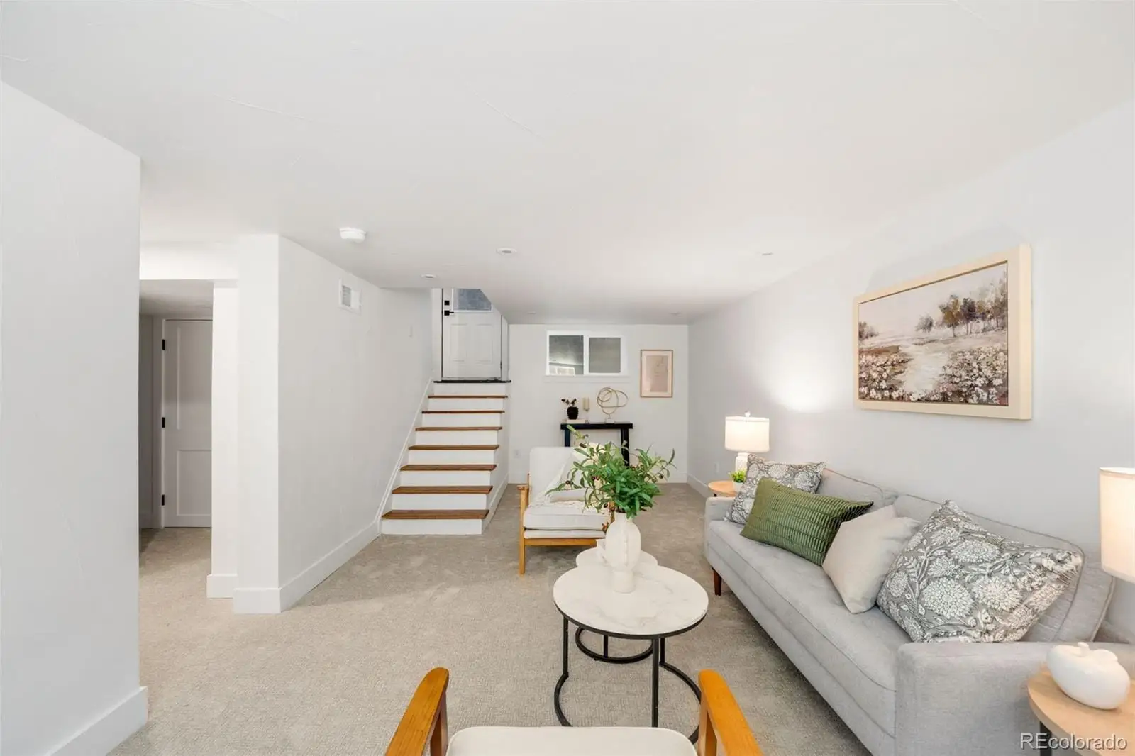 A living room with furniture and wooden floor at 2343 Dahlia Street