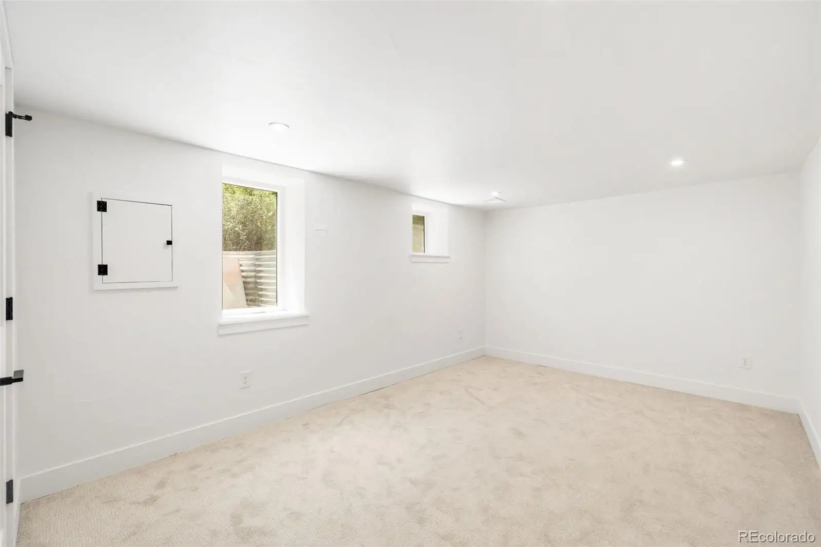 An empty room with windows at 2343 Dahlia Street