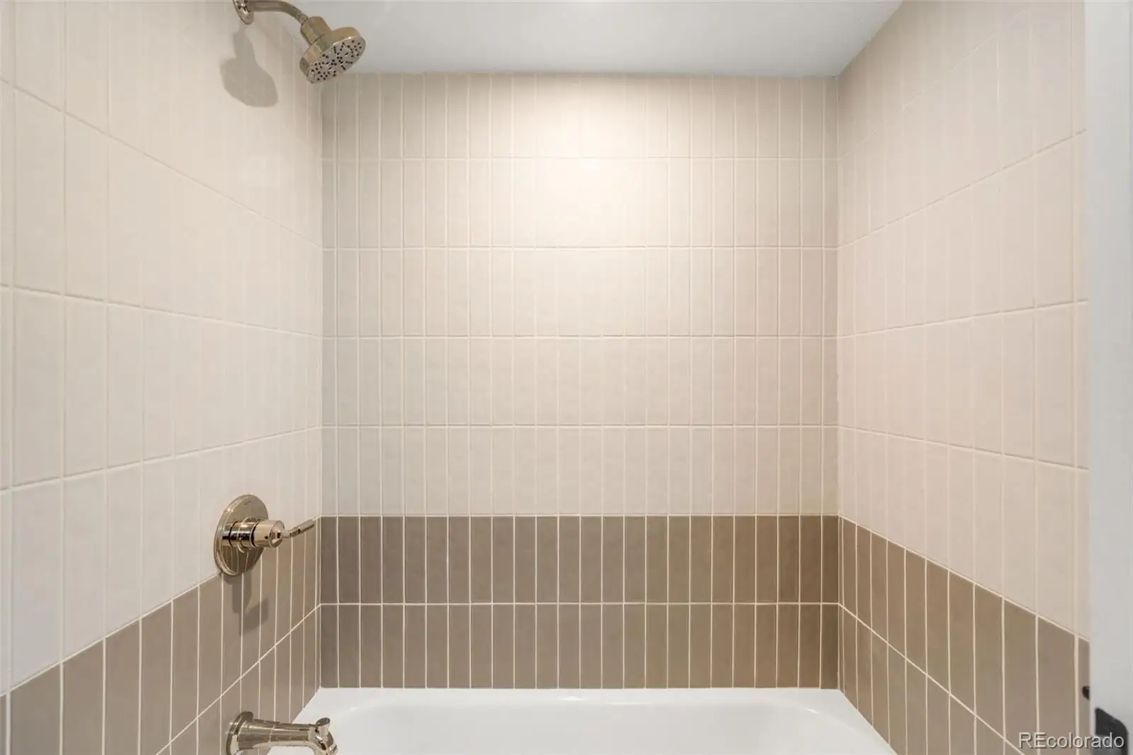 A bathroom with a bathtub and shower at 2343 Dahlia Street