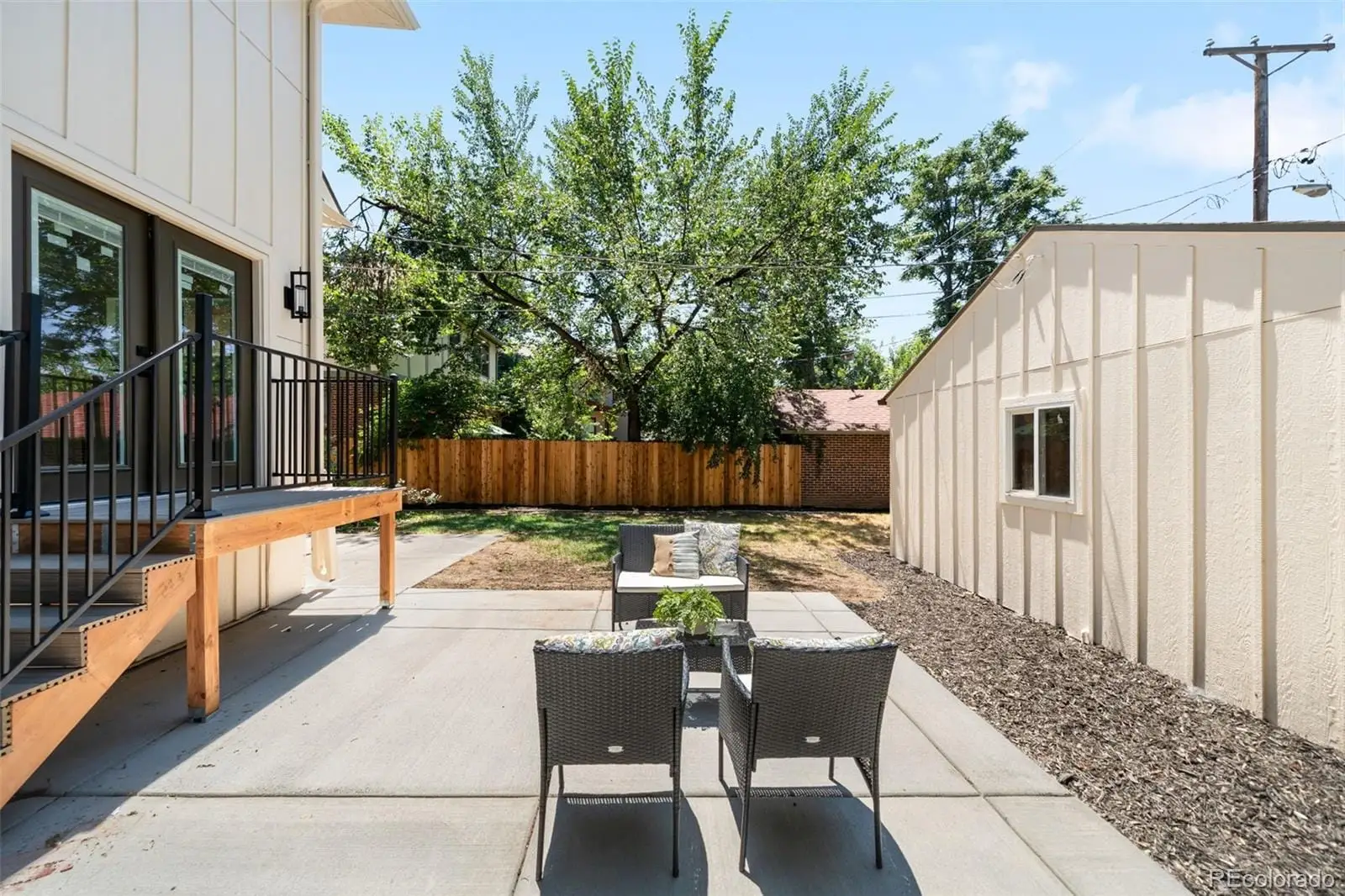A view of backyard with a patio and outdoor seating at 2343 Dahlia Street