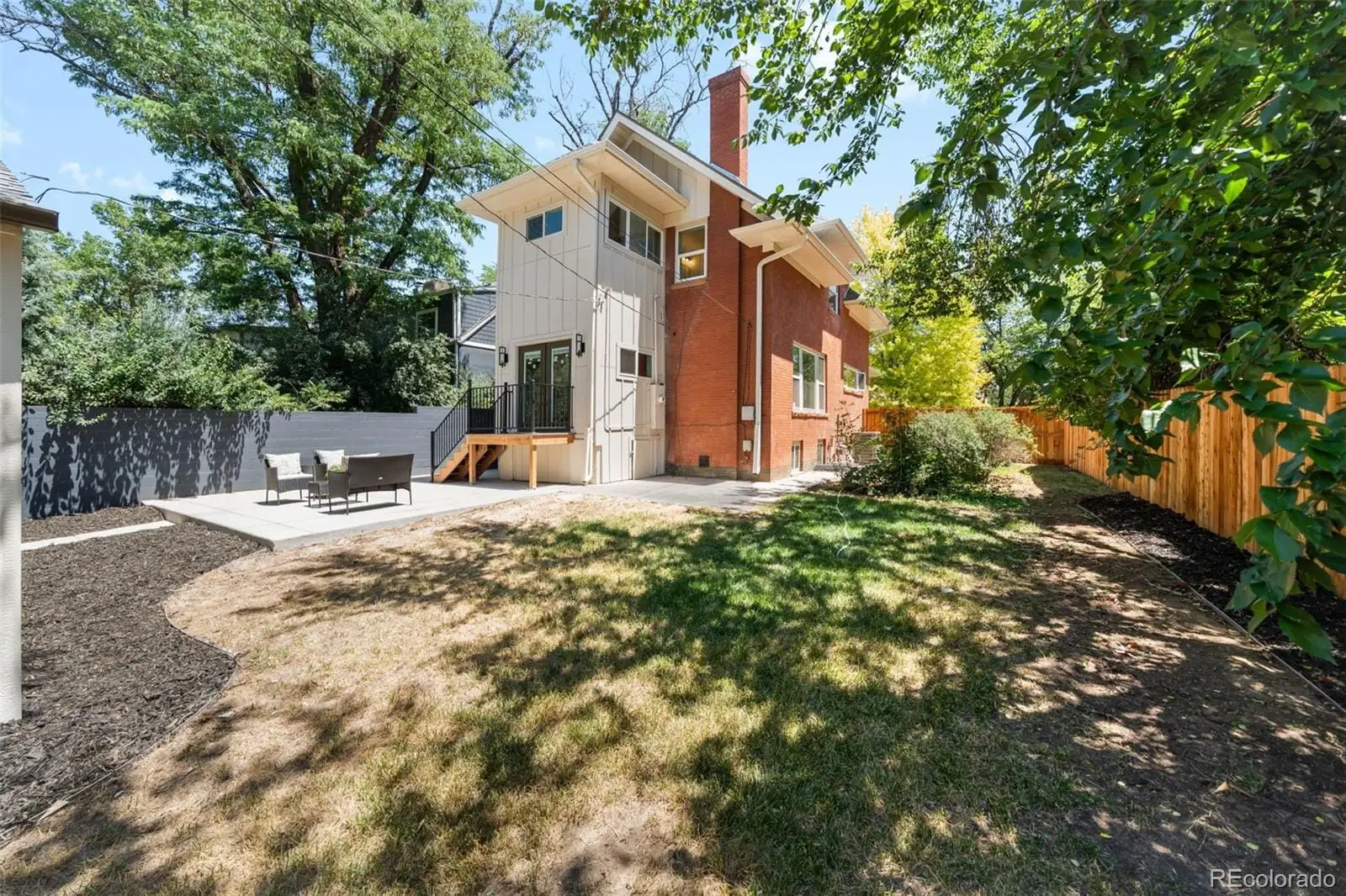 A front view of a house with a yard at 2343 Dahlia Street